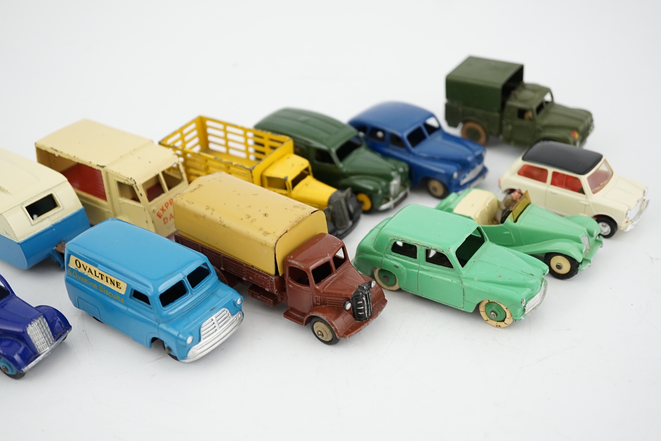 Twelve Dinky Toys, including; Austin van, Vanguard, Market Gardener’s wagon, Hillman Minx, MG Midget, Bedford van, etc.